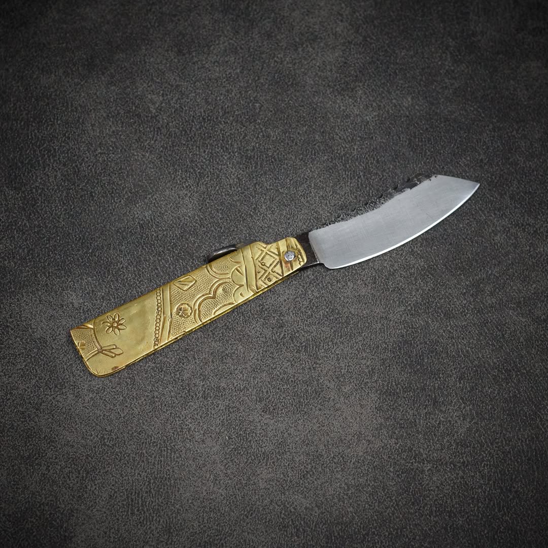 steel and brass folding knife