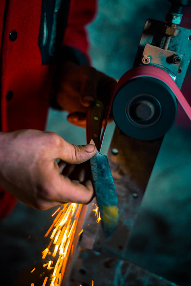 shaping the knife handle by removing material